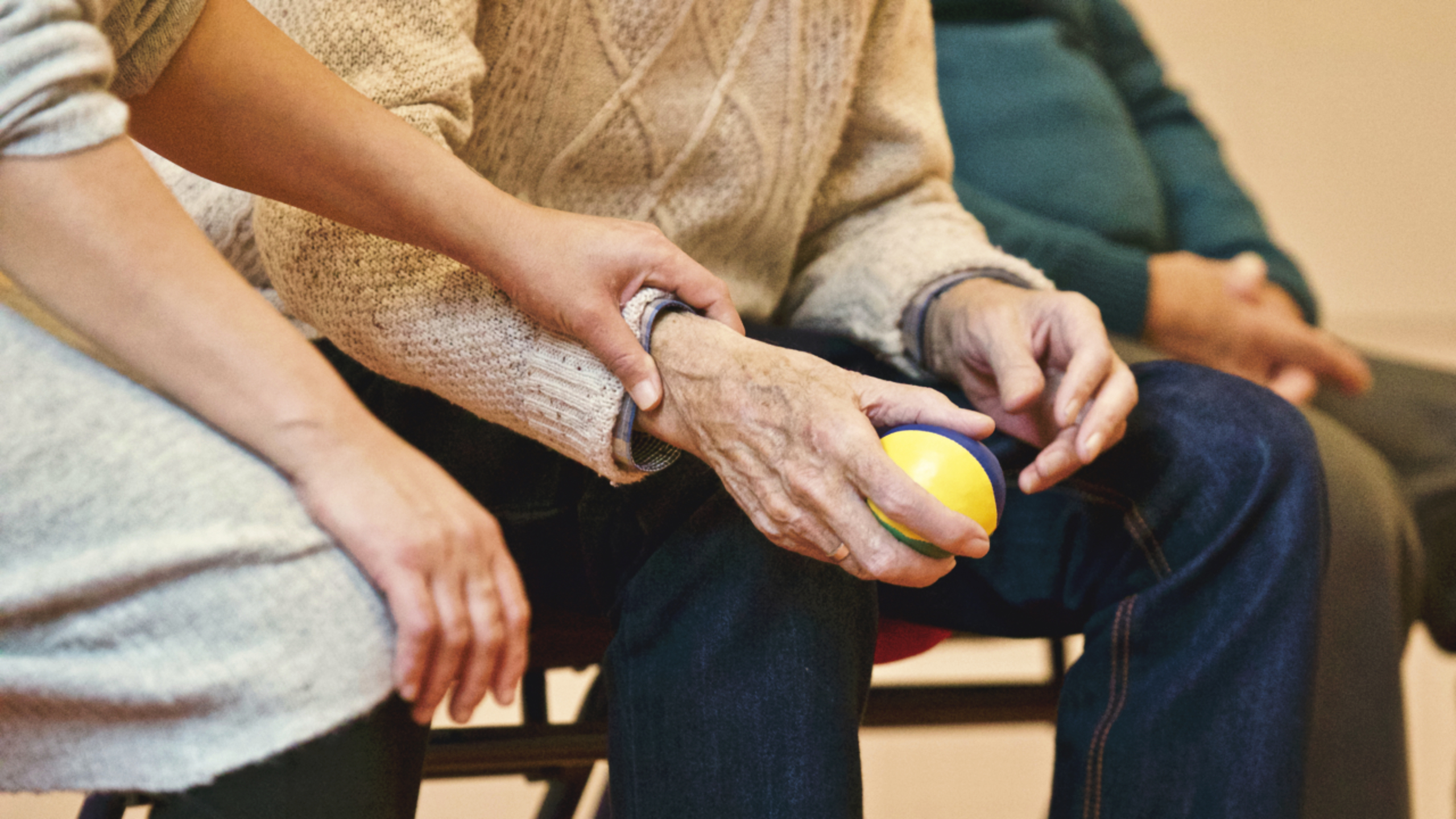 Care elderly people hands comfort ball