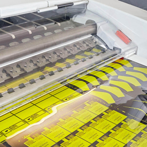 A printing machine, printing yellow labels